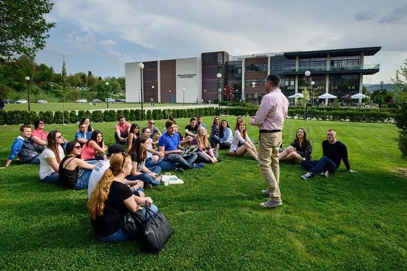 Group discussion on a grassy area.